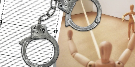 Scale model of the crime scene alongside a police height chart with handcuffs in the foreground