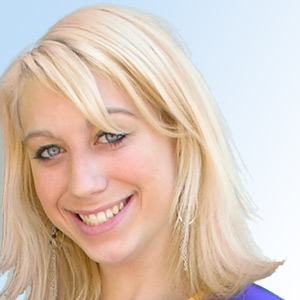 Smiling young woman with shoulder-length blonde hair