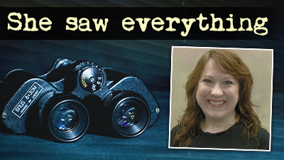 Smiling woman with long reddish-brown hair alongside binoculars and the words "She saw everything"