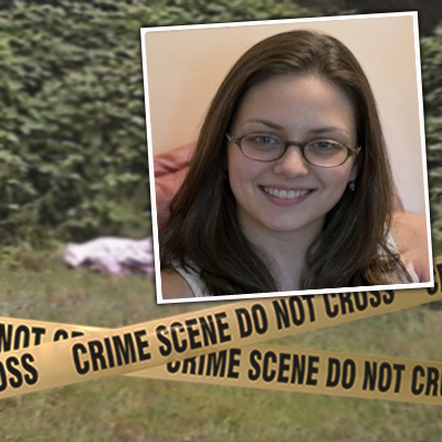 Crime scene tape in front of a covered body in a grassy location with a smiling brunette woman with glasses in the foreground