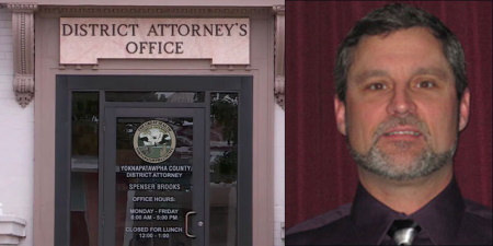 Entrance to the DA's office alongside a man with short dark hair and salt and pepper beard and mustache