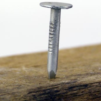 Flathead nail sticking out of a board