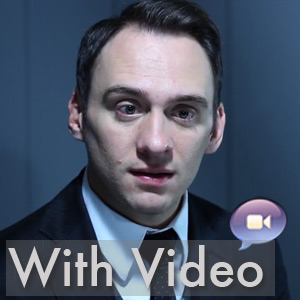 Handsome businessman in an office setting with the label "With Video" in the foreground