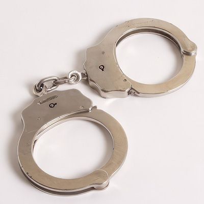 Handcuffs on a plain background