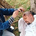 Stage blood being applied to create the head wound