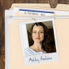 Photo of a smiling woman with long dark hair clipped to a manila folder