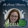 Funeral card with a photo of a smiling brunette woman with glasses with the Oxford Weekly Planet logo in the foreground