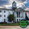 Oxford, MS courthouse with the Oxford Weekly Planet logo in the foreground