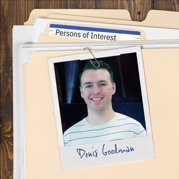 Manila folder with a photo of a smiling man with short dark hair clipped to it