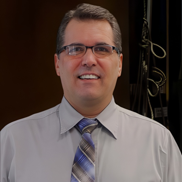 Smiling, clean cut man with glasses