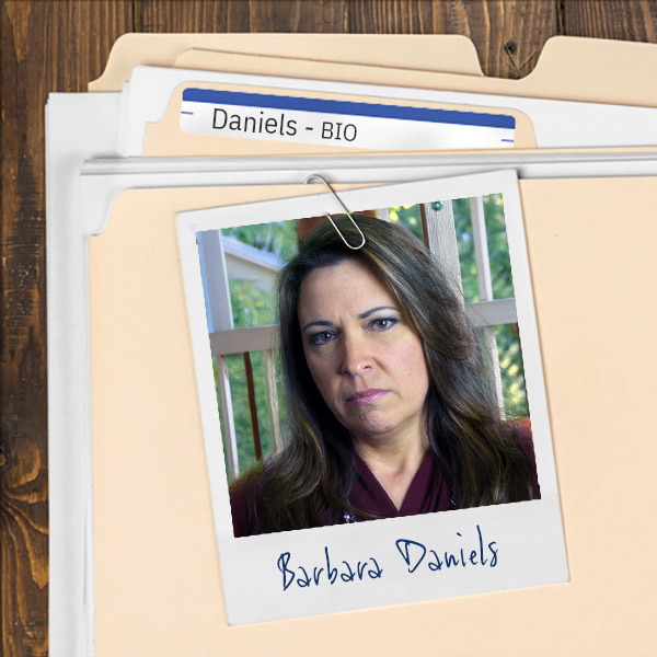 A file folder with a photo of a angry-looking woman with long dark hair.