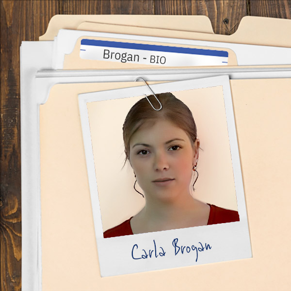 We see a file folder on a desk. Clipped to the folder is a picture of a young woman with dark hair and glasses
