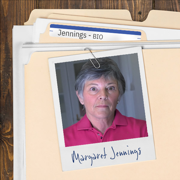 A file folder with a photo of a A file folder with a photo of an unsmiling older woman with dark, graying hair.