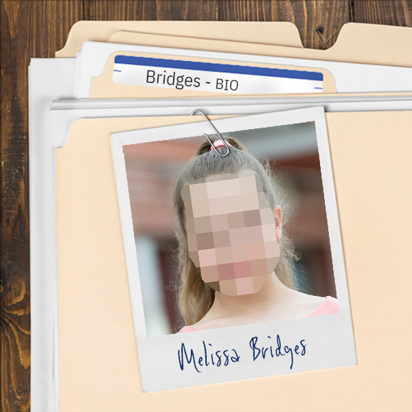 We see a file folder on a desk. Clipped to the folder is a picture of a pixelated photo of tween girl with long hair