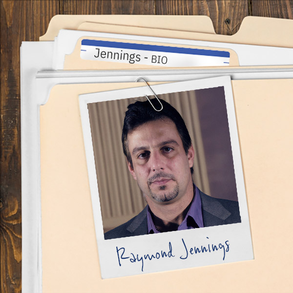 Serious-looking man with dark hair and a dark mustache and goatee