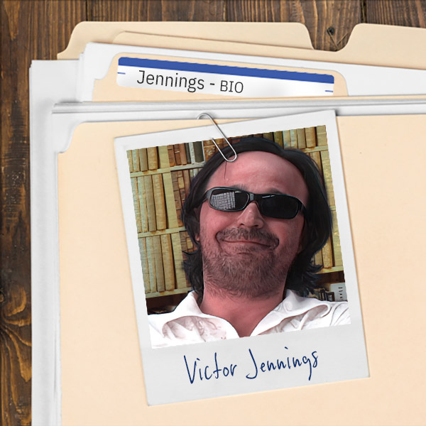 A file folder with a photo of a smirking man with dark hair, scruffy facial hair, and sunglasses.