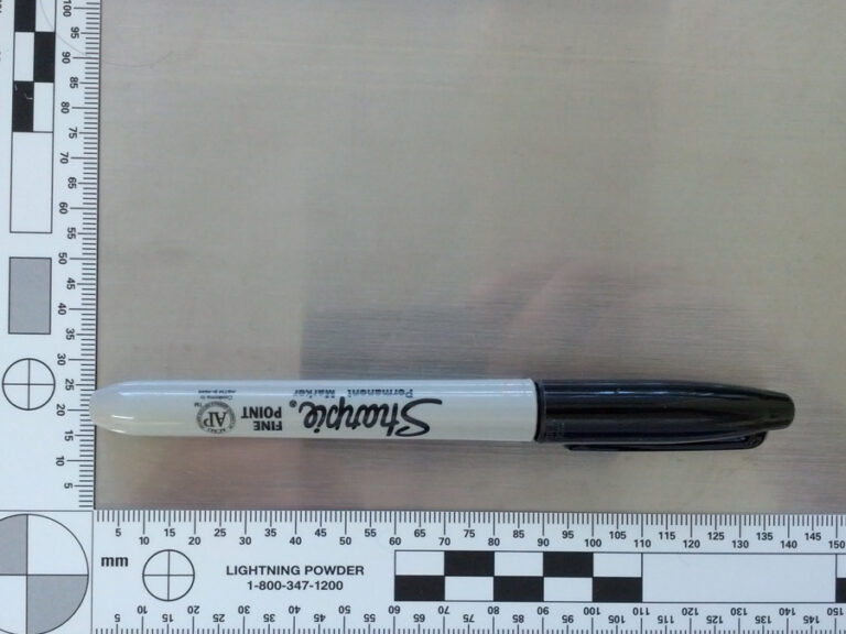a picture of a sharpie taken near a 90-degree measuring ruler