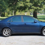 a picture of a dark blue colored car