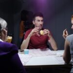a picture of 3 directors and actors taking a lunch break behind the scenes.