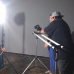 A man recording with a slow-moving camera.