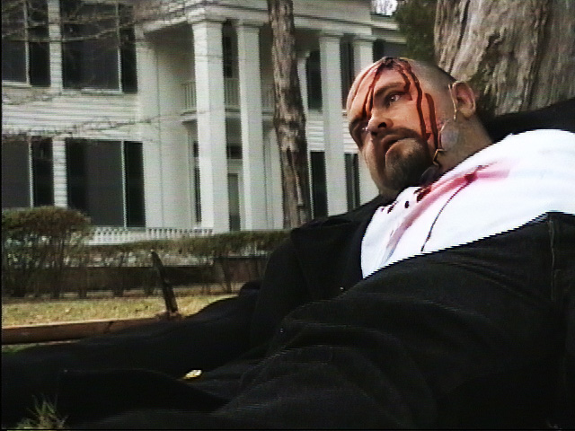 A German man was found dead on the grounds of Rowan Oak Man with a bloody head wound leaning against a tree with Rowan Oak in the background