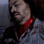 A picture of an unconscious man with blood streaming from his neck.