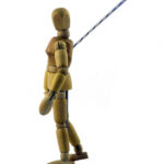 A picture of a dummy with a rope attached to it showcasing a trajectory