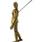 A picture of a dummy with a rope attached to it showcasing a trajectory