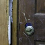 A picture of a doorknob with scratches around it