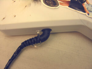a picture of a controller cable mod attached to the guitar