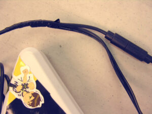 a picture of some electrical tape being used on the guitar.
