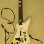 A picture of a white electric guitar