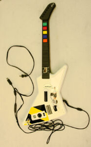 A picture of a white electric guitar game controller