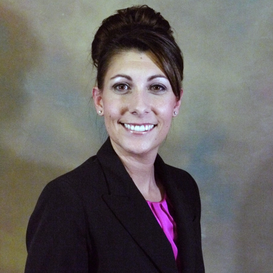 Smiling businesswoman with arms folded