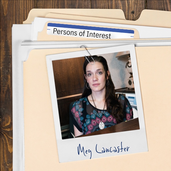 Manila folder with a photo of a woman with long dark hair clipped ot it
