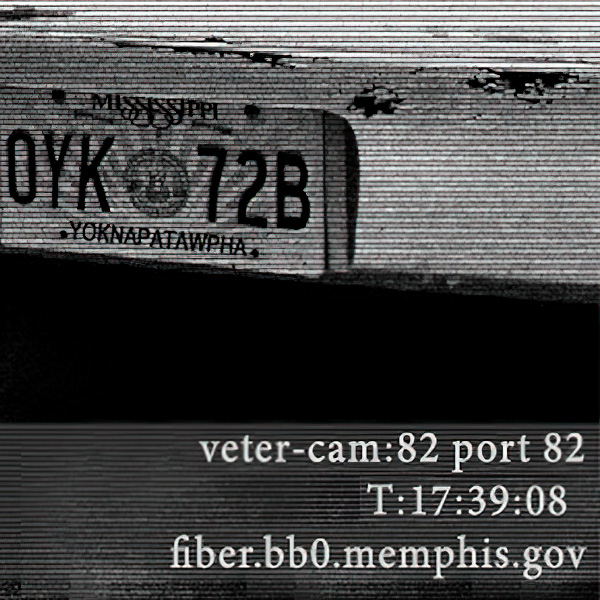 Grainy photo of a vehicle's license plate