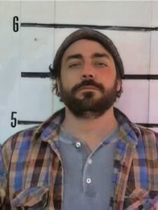 Man with a dark beard and mustache