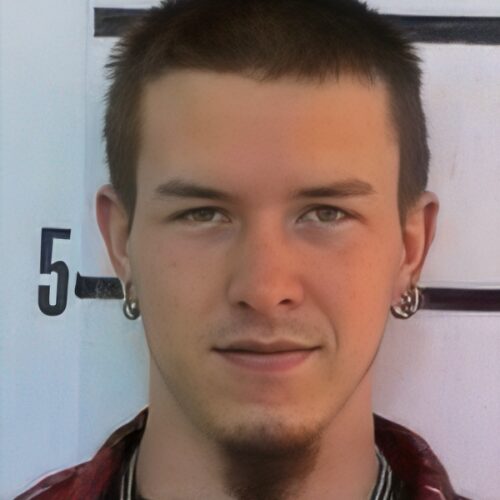 Young man with dark hair and goatee