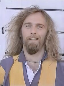 Man with long blond hair, beard and mustache