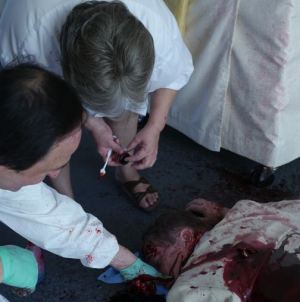 Actor and crew staging the murder scene