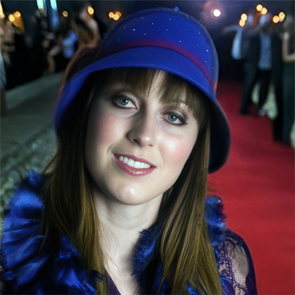 Smiling brunette woman in a blue hat