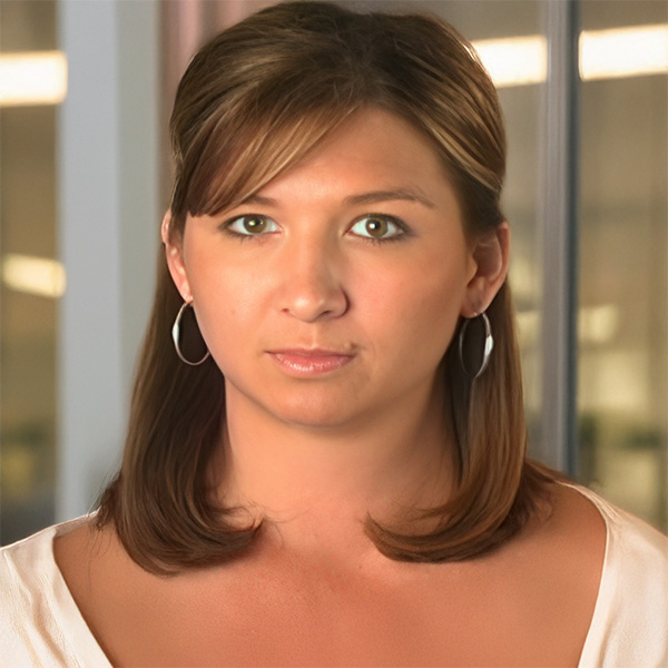 Serious-looking young woman with shoulder-length brown hair