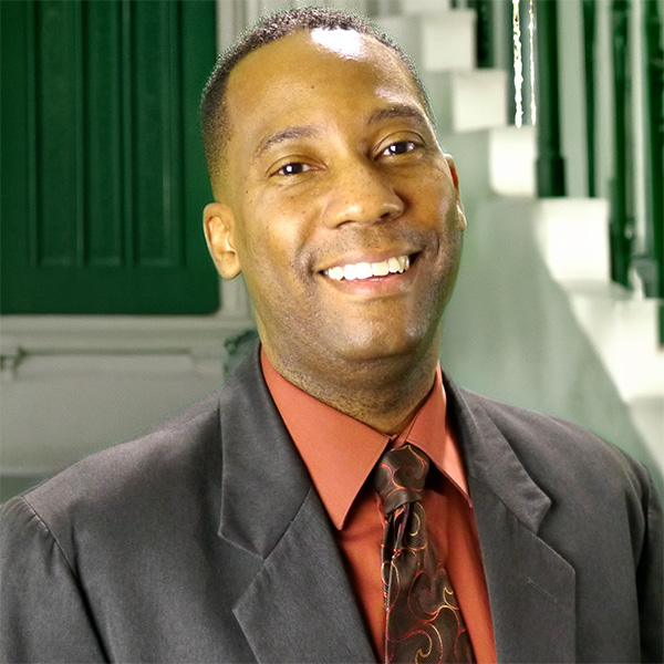 Smiling man in a dress shirt and tie