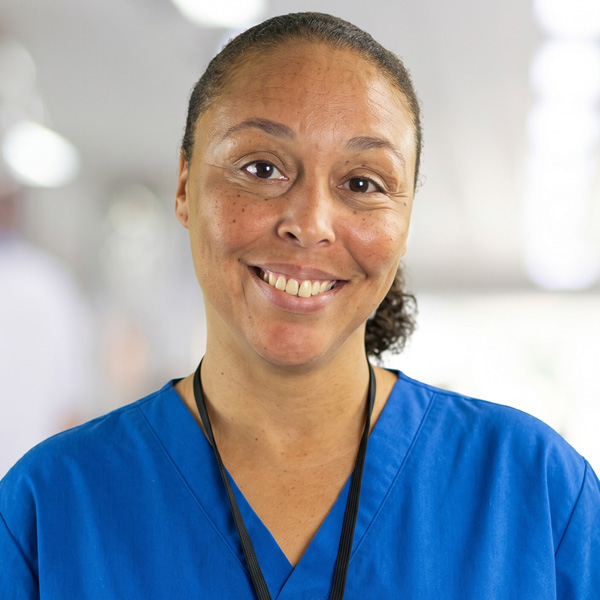 Smiling woman wearing scrubs